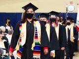 Lemoore Middle College High School grads march into the West Hills Golden Eagle Arena Friday night for their graduation ceremony.